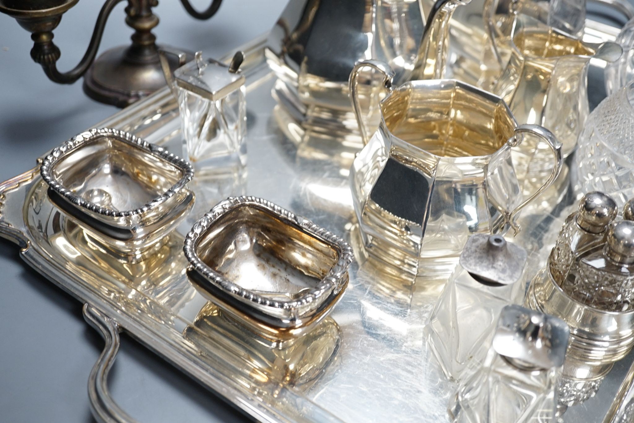 A quantity of silver plated tea/coffee wares including two handled tray, decanters, salts etc., 62cm